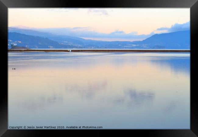 Serene Reflections at Ull Salt Marshes Framed Print by Jesus Martínez