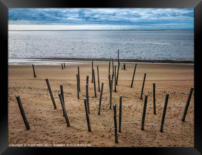 Poles on Hjerting public beach promenade in Esbjerg, Denmark Framed Print by Frank Bach