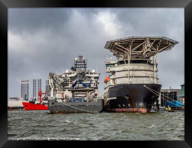 Supply ships for oil and wind power in Esbjerg flooded harbor, Denmark  Framed Print by Frank Bach