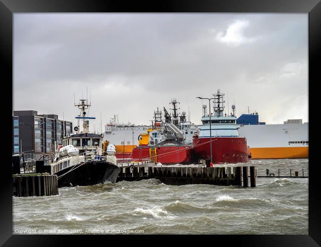 Supply ships for oil and wind power in Esbjerg flooded harbor, Denmark  Framed Print by Frank Bach
