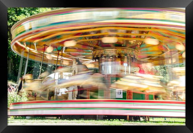 Carousel spinning  Framed Print by Richard Ashbee
