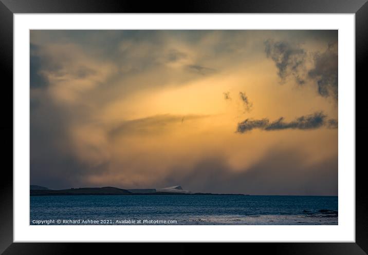 Storm clouds over a snowy Noss in Shetland Framed Mounted Print by Richard Ashbee