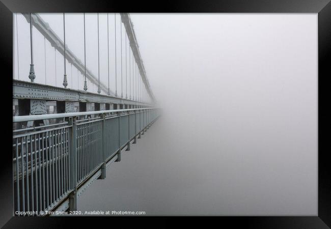 The Menai Suspension Bridge disappears into the fog  Framed Print by Tim Snow