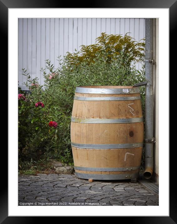 A vertical shot of an old big wooden rain barrel in the garden Framed Mounted Print by Ingo Menhard