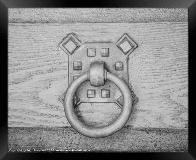 A closeup shot of an old metal doorknob on a wooden door Framed Print by Ingo Menhard