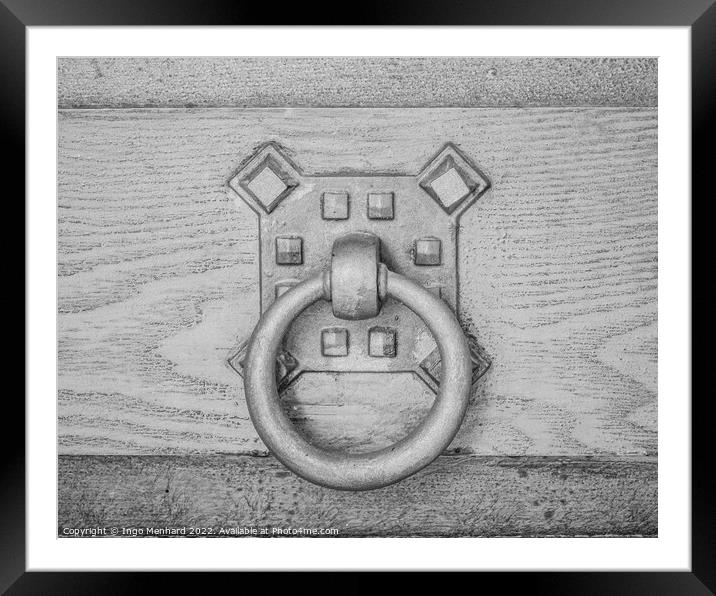 A closeup shot of an old metal doorknob on a wooden door Framed Mounted Print by Ingo Menhard