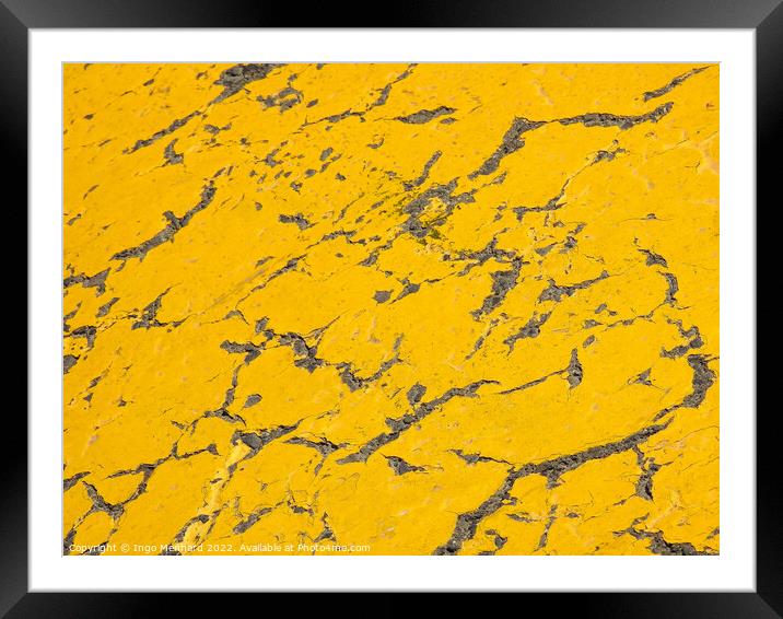 A closeup shot of yellow cracked surface Framed Mounted Print by Ingo Menhard