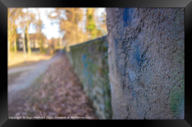 Closeup shot of a stone fence texture in a park Framed Print by Ingo Menhard