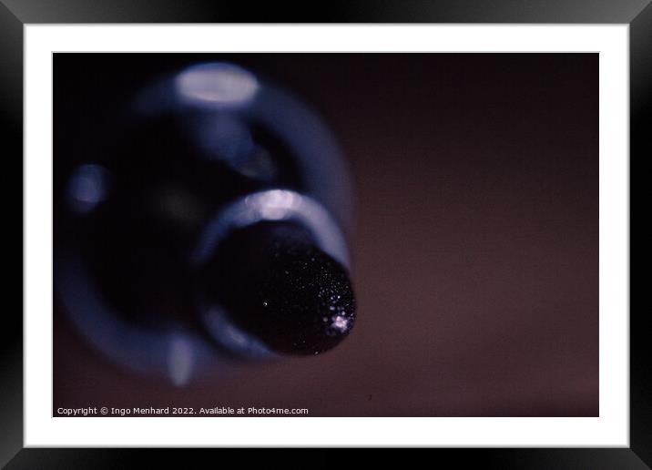 A shallow focus macro shot of a small turned off lightbulb Framed Mounted Print by Ingo Menhard