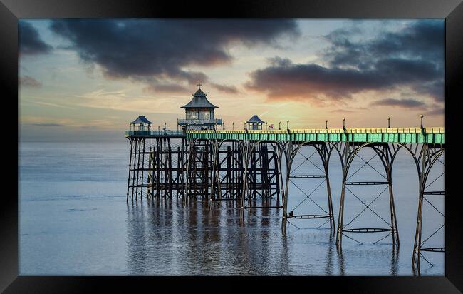 Clevedon Pier with a Moody Sunset Sky Framed Print by Tracey Turner