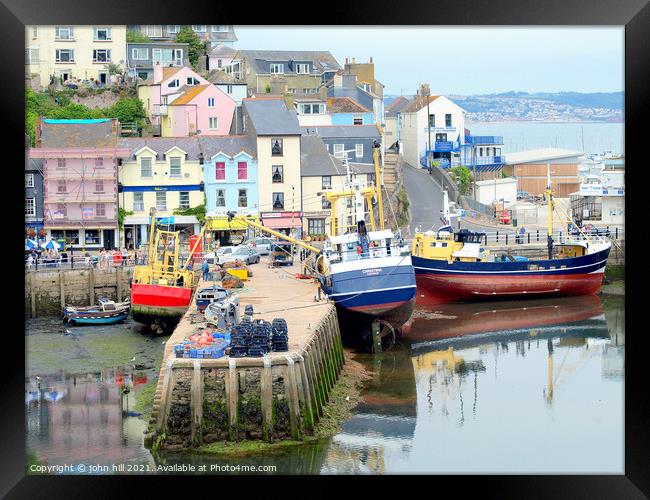 Brixham harbour quay in Devon. Framed Print by john hill