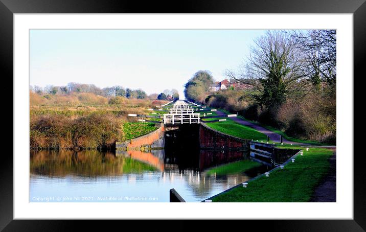 Caen hill canal locks at Devizes in Wiltshire, UK. Framed Mounted Print by john hill