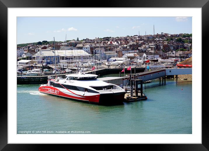 Red jet ferry at West Cowes on the Isle of Wight. Framed Mounted Print by john hill