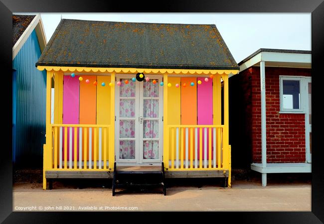 Colorful beach hut. Framed Print by john hill