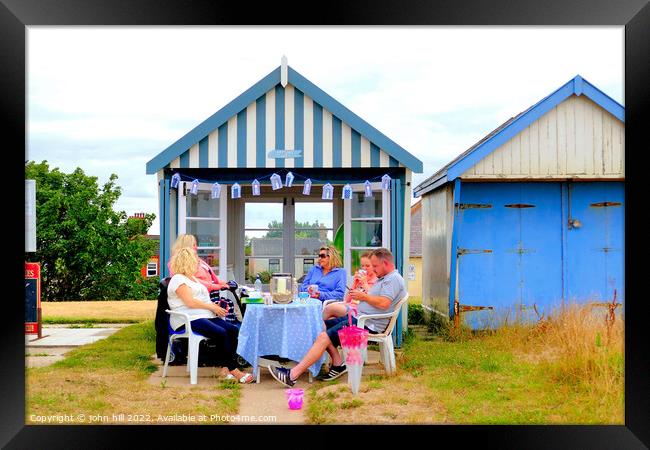 Beach hut tea party. Framed Print by john hill