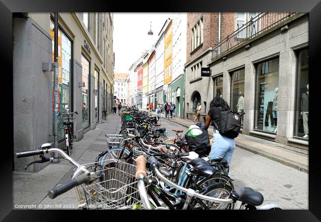 Back street bicycle Parking Copenhagen Denmark Framed Print by john hill