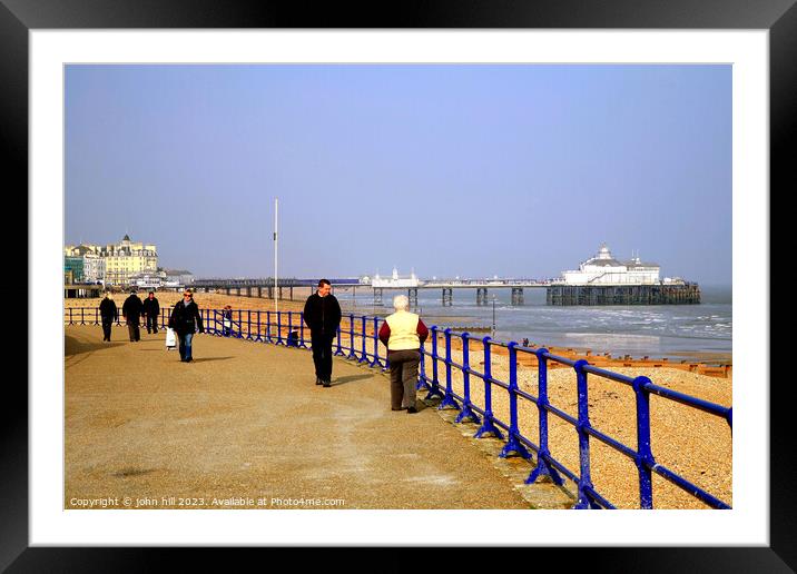Serene Stroll along Eastbourne's Iconic Coastline Framed Mounted Print by john hill