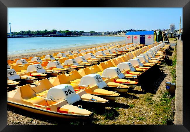 Pedalos on the beach at Weymouth in Dorset. Framed Print by john hill