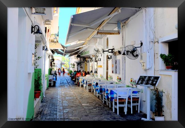 Food and drink in a back alley of Skiathos town in Greece.   e Framed Print by john hill