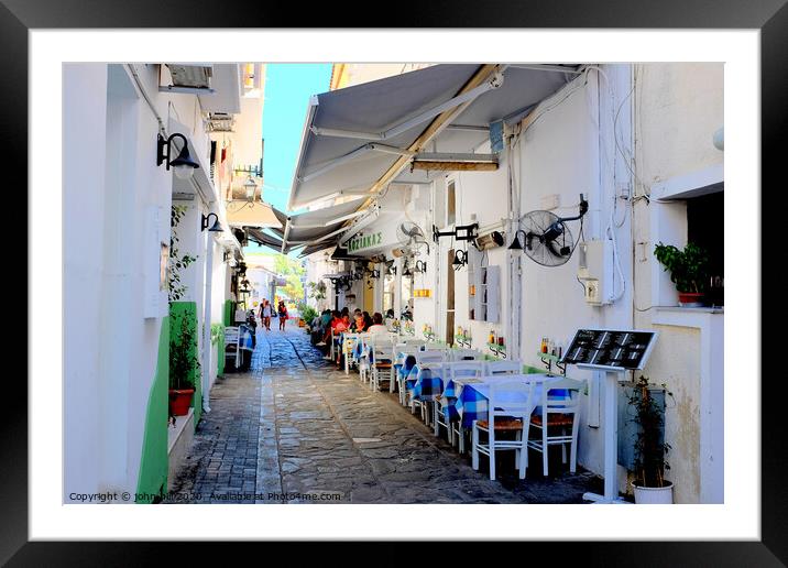 Food and drink in a back alley of Skiathos town in Greece.   e Framed Mounted Print by john hill