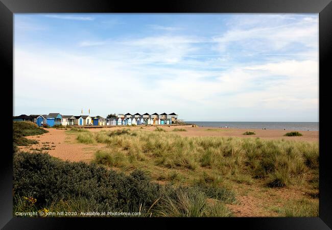 Beach huts at Chapel point at Chapel St. Leonards in Lincolnshire. Framed Print by john hill