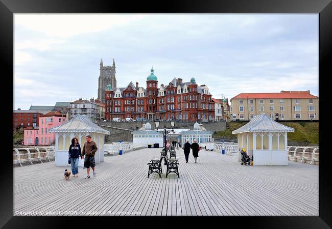 The boardwalk and town from the pier at Cromer in Norfolk.  Framed Print by john hill