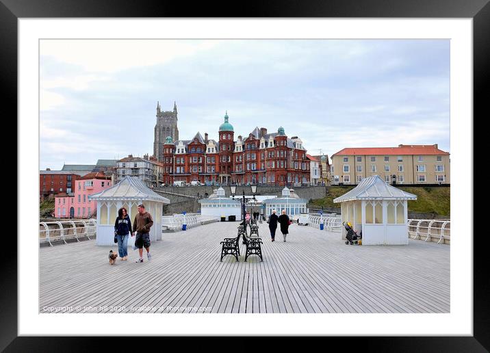 The boardwalk and town from the pier at Cromer in Norfolk.  Framed Mounted Print by john hill