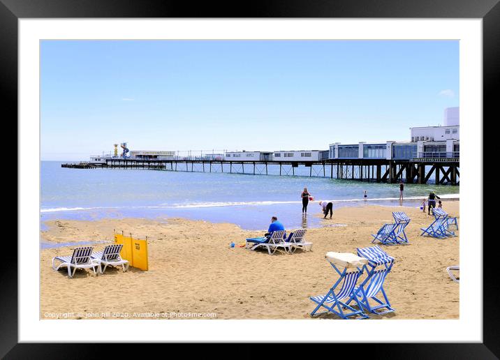 Relaxation in the front of Sandown pier on the Isle of Wight.  Framed Mounted Print by john hill