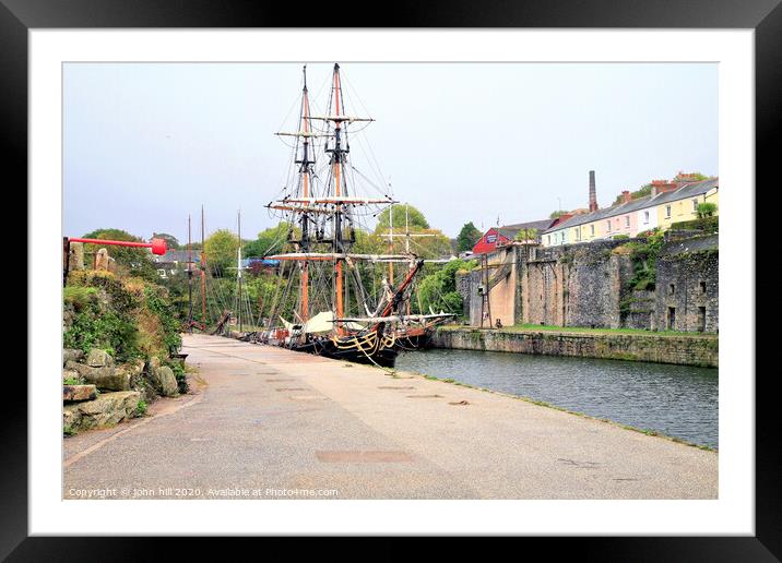 Tall ships moored in Harbour at Charlestown in Cornwall. Framed Mounted Print by john hill