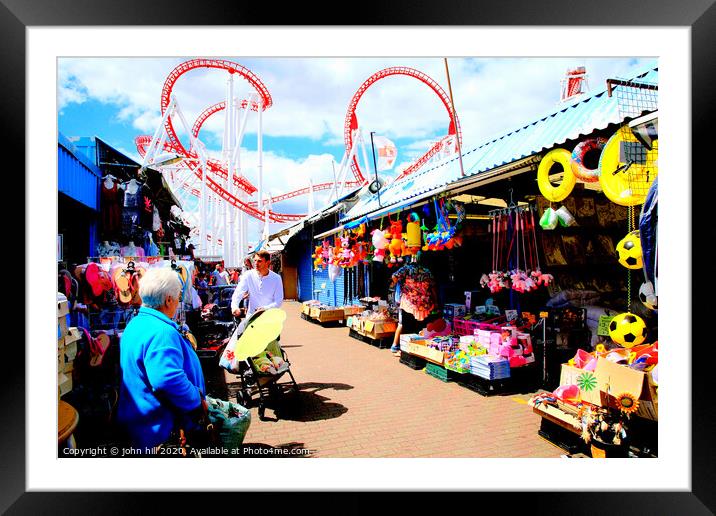 Ingoldmells outdoor market with funfair behind at Skegness in Lincolnshire. Framed Mounted Print by john hill