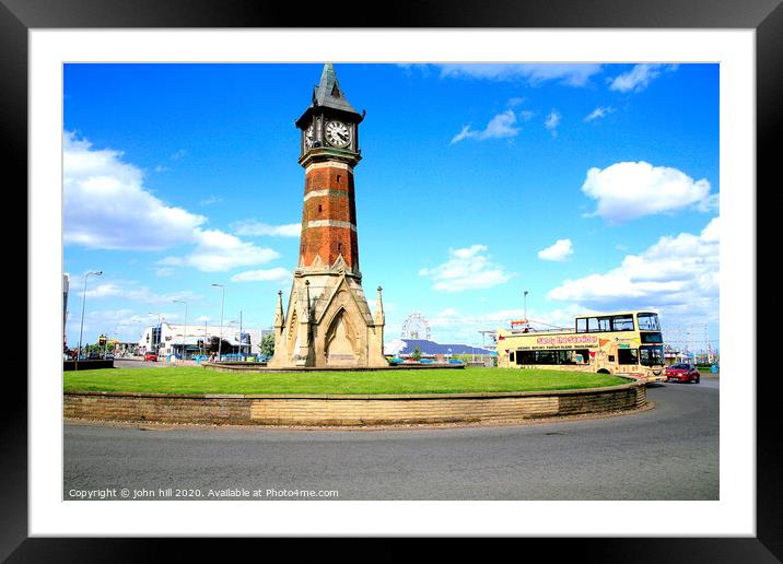 The landmark clock tower against a blue sky at Skegness in Lincolnshire. Framed Mounted Print by john hill