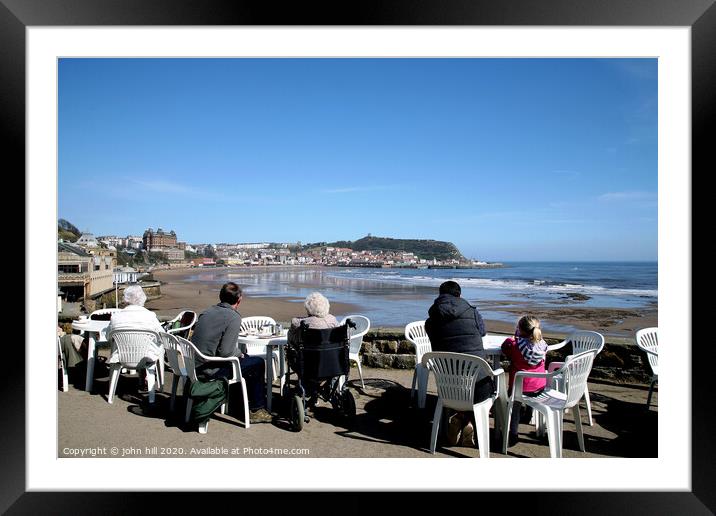 Tourists enjoying the view of Scarborough over the bay at low tide Framed Mounted Print by john hill
