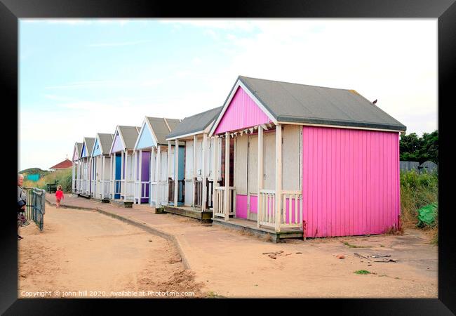 Wooden beach huts at Sandilands near Sutton on Sea in Lincolnshire. Framed Print by john hill