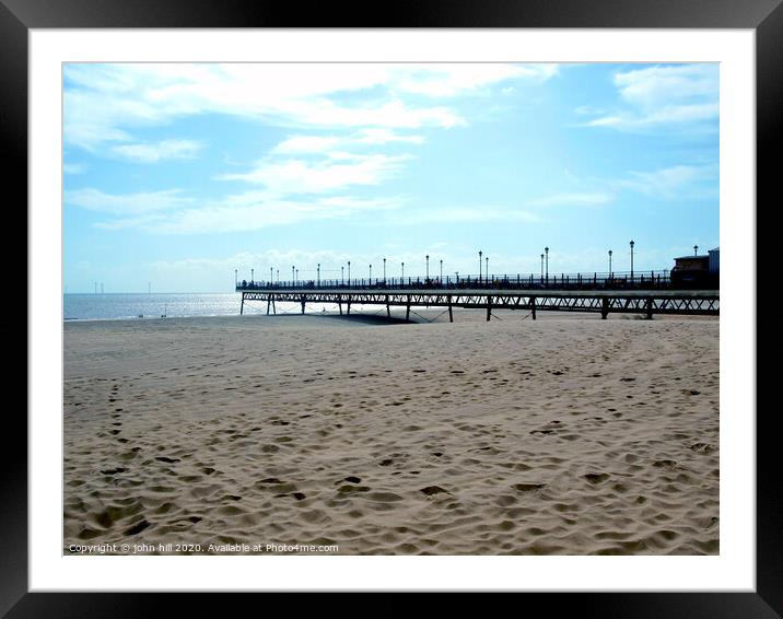 Skegness pier silhouetted against a morning sky. Framed Mounted Print by john hill
