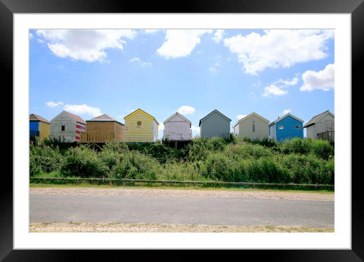 Behind the Beach Huts Silhouette. Framed Mounted Print by john hill