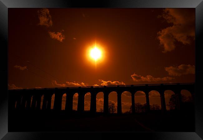 sunset over viaduct Framed Print by Eddie Howland