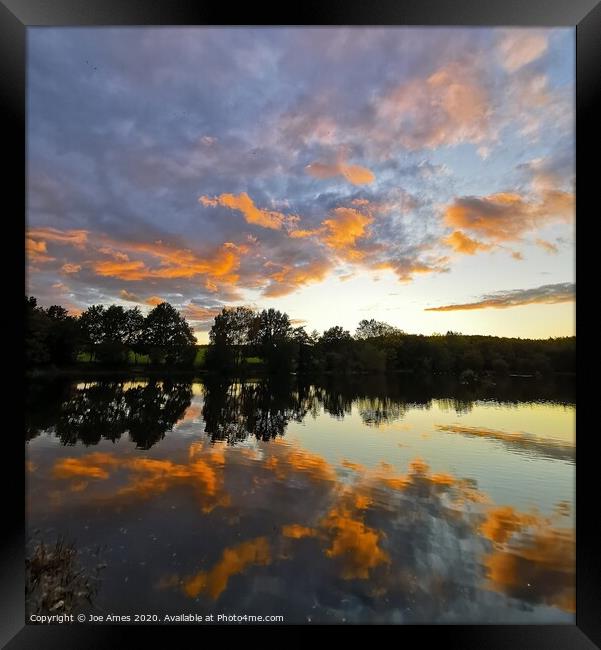 Sunset over the reservoir  Framed Print by Joe Ames
