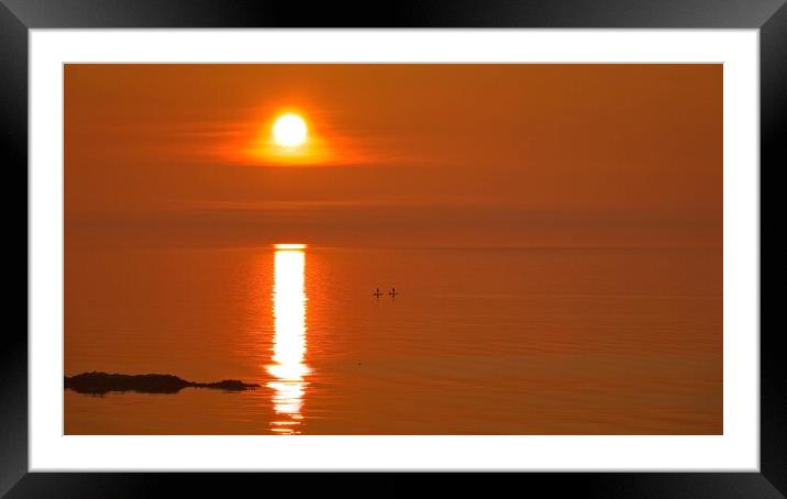 Paddleboarders enjoying the sunrise Framed Mounted Print by Cecil Owens