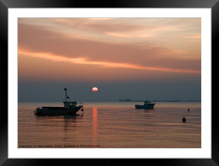 Setting sun above the pier at Southend on Sea, Essex, UK. Framed Mounted Print by Peter Bolton