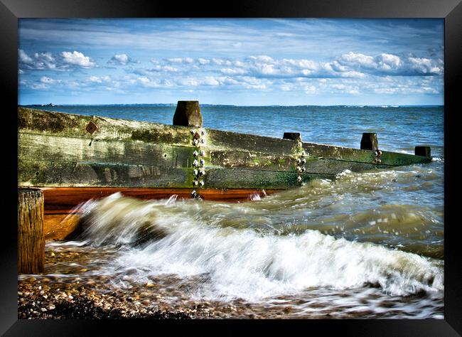Waves crashing over a breakwater on the beach at Westcliff on Sea, Essex, UK Framed Print by Peter Bolton