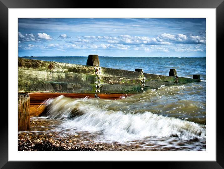Waves crashing over a breakwater on the beach at Westcliff on Sea, Essex, UK Framed Mounted Print by Peter Bolton