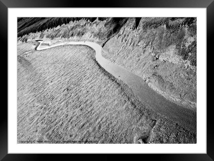 A black and white 'abstract in nature' of a natural tidal drainage channel through the dunes. Framed Mounted Print by Peter Bolton
