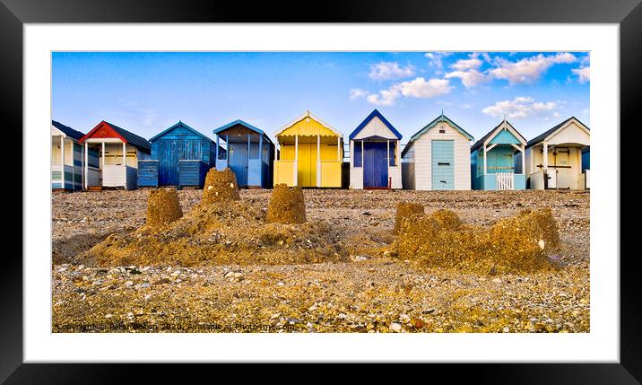 Beach huts and sandcastles at Thorpe Bay, Thames Estuary, Essex, UK. Framed Mounted Print by Peter Bolton