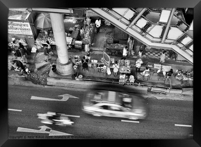 Black and white view from overhead of a street with food vendors and traffic. Bangkok, Thailand. Framed Print by Peter Bolton