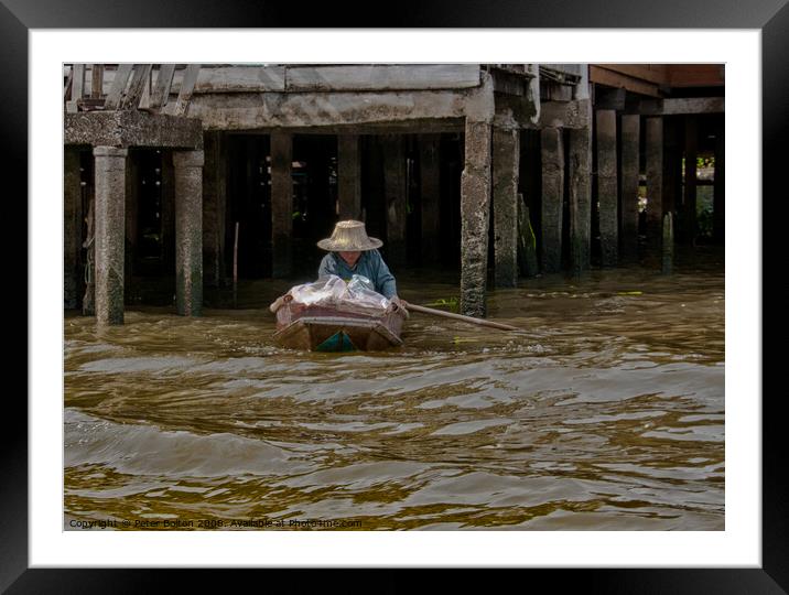 A local resident in her day to day mode of transport on a canal in Bangkok, Thailand. Framed Mounted Print by Peter Bolton