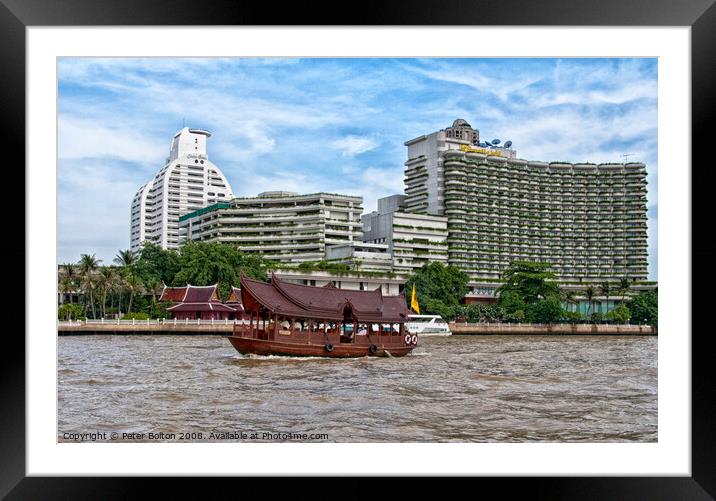 A tourist junk passing condominium towers on Chao Phraya river, Bangkok, Thailand. Framed Mounted Print by Peter Bolton