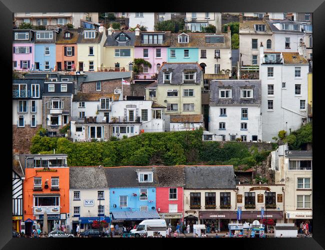 Detail of some of the colourful houses surrounding the harbour in Brixham, Devon, UK. Framed Print by Peter Bolton
