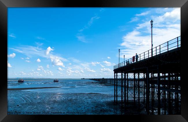 Looking along Southend Pier from the shore towards the pier head. Southend on Sea, Essex, UK.  Framed Print by Peter Bolton
