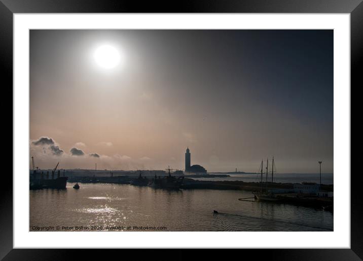 Early morning, leaving Casablanca, Morocco. Silhouette of the Grand Mosque as the sun burns through the mist. Framed Mounted Print by Peter Bolton