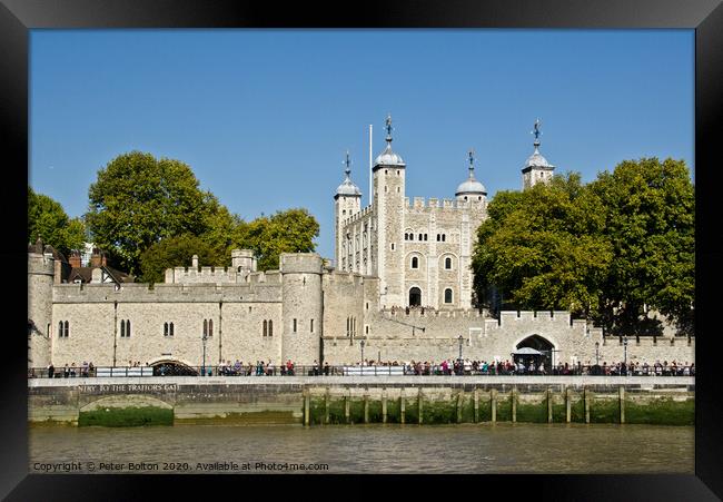 Tower of London from the river Thames, London, UK. Framed Print by Peter Bolton